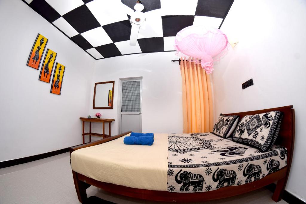 Postel nebo postele na pokoji v ubytování Royal Residence Negombo