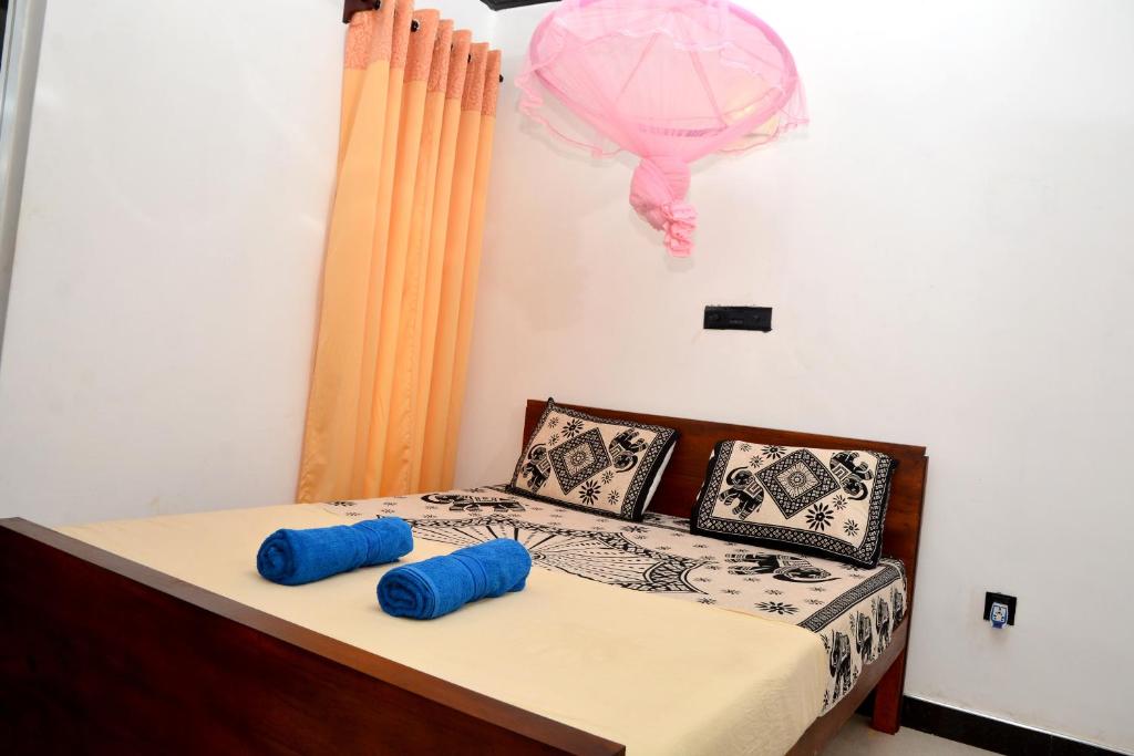 Postel nebo postele na pokoji v ubytování Royal Residence Negombo