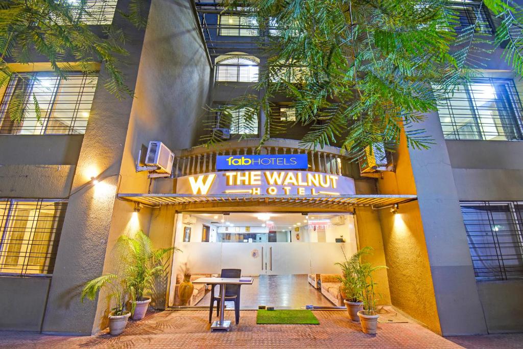 a lobby of a building with a sign that reads the walkway of fame at FabHotel The Walnut in Pune