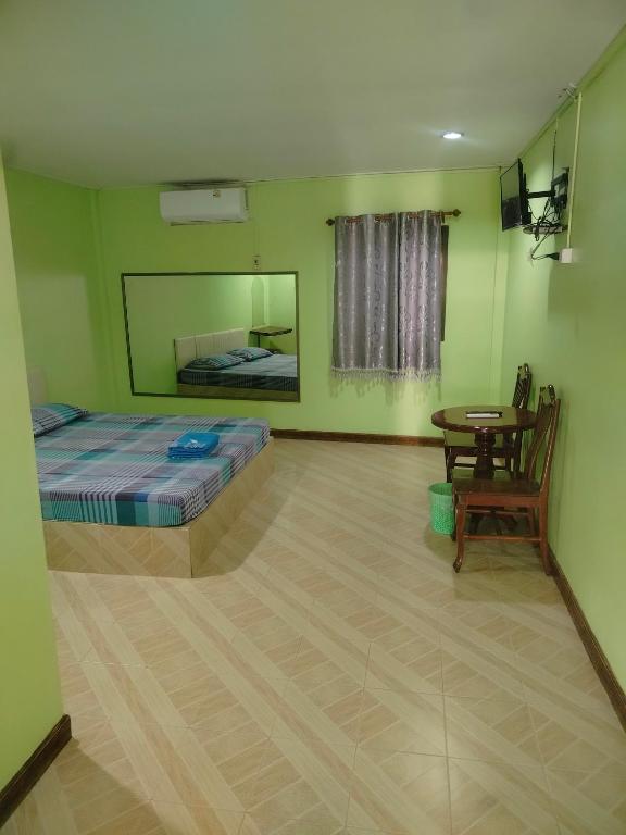 En eller flere senge i et værelse på Hongthong