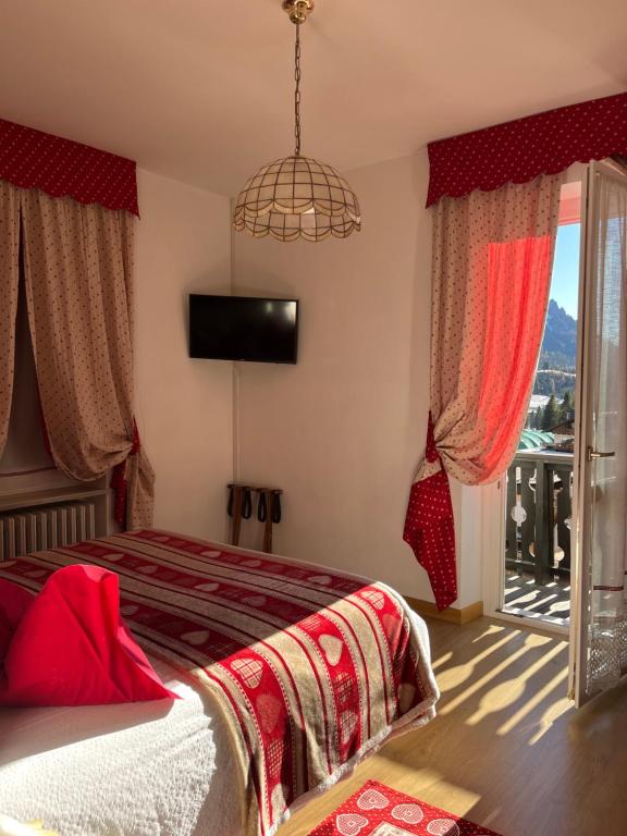 Postel nebo postele na pokoji v ubytování Hotel Garni Suisse