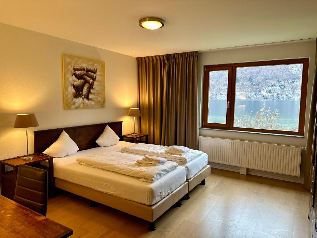 Postel nebo postele na pokoji v ubytování Walensee House & Apartments