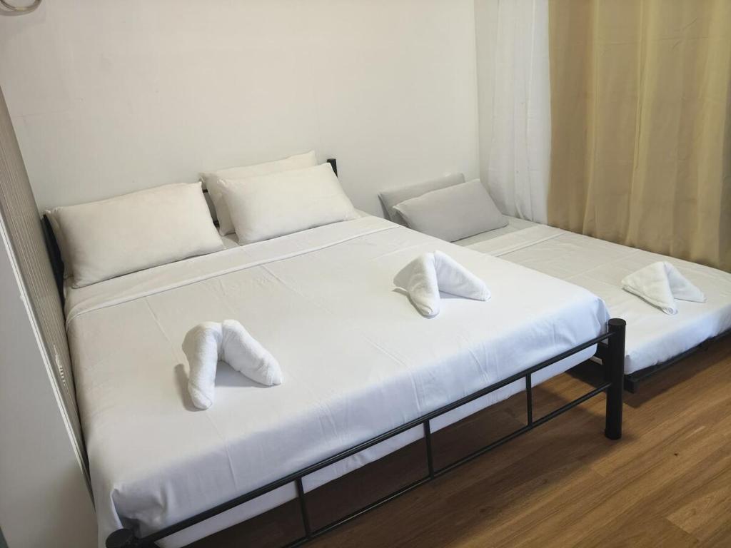 Giường trong phòng chung tại L & Ev Be My Guest