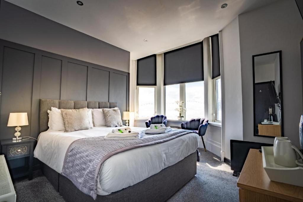 En eller flere senge i et værelse på Woodhouse Hotel Blackpool Promenade