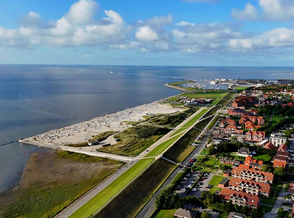 an aerial view of a city and the water at Ferienwohnung Seesternchen am Deich2 C46 in Norden