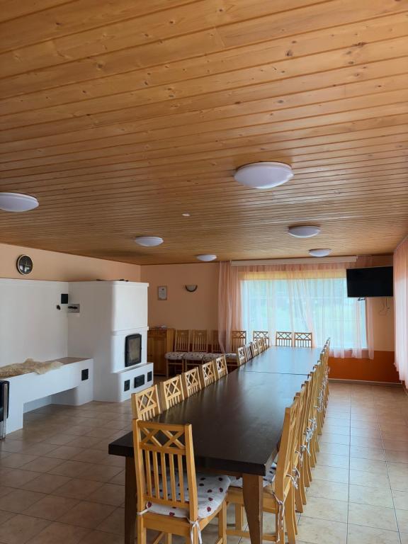 a large dining room with a large table and chairs at 5 bedroom house in Roosisaare