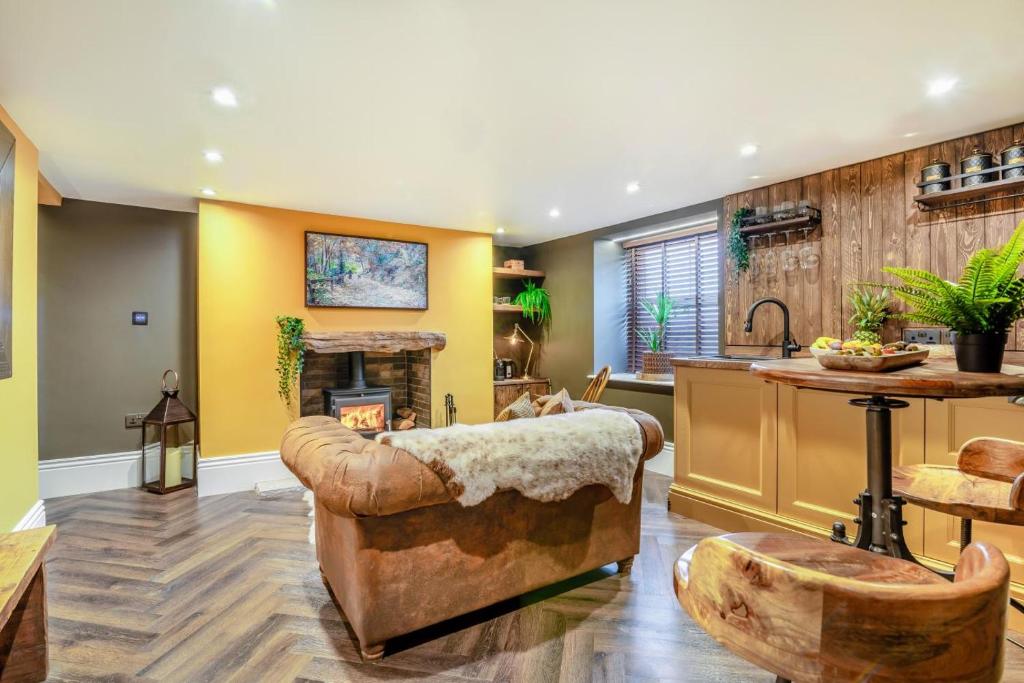 a living room with a couch and a fireplace at 1 Bed in Holmfirth oc-c33380 in Holmfirth