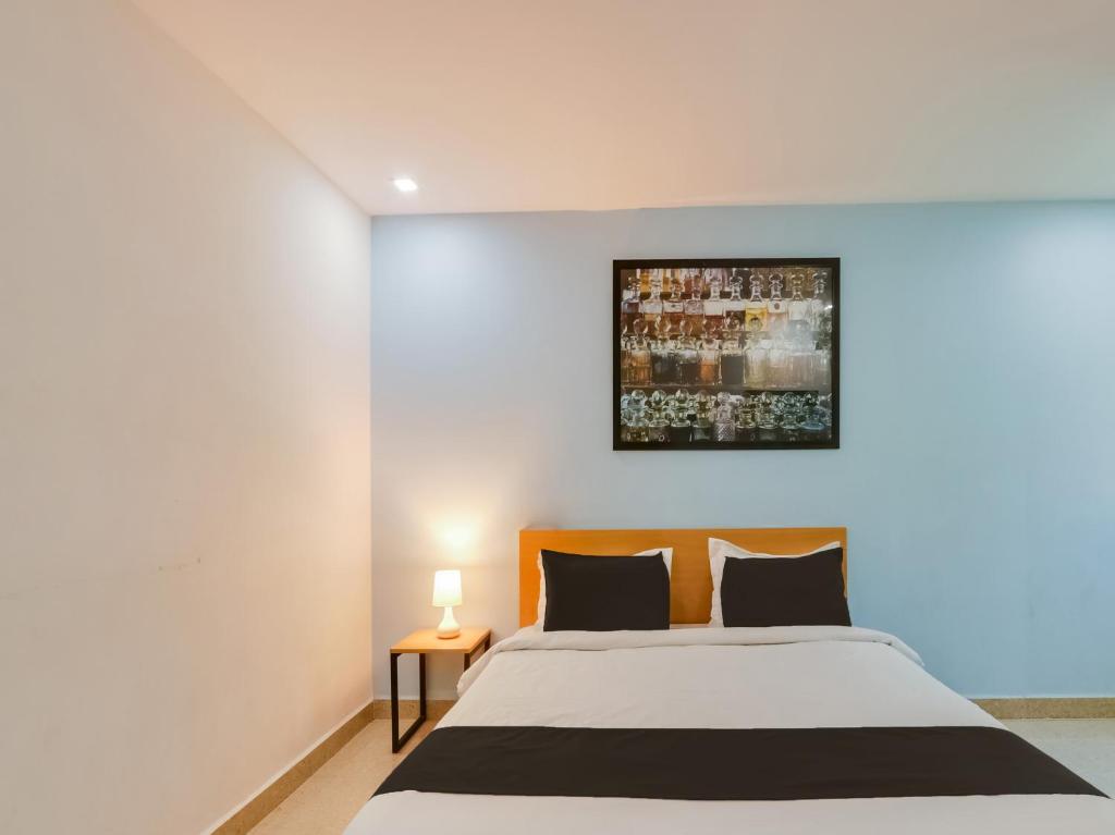 Giường trong phòng chung tại Super Townhouse Qualia Prime