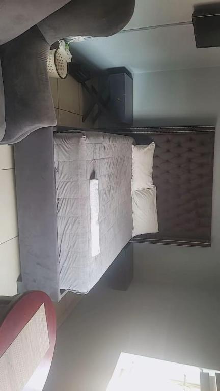 a bed in a room with two pillows at Rainbow Guest House in Maraisburg