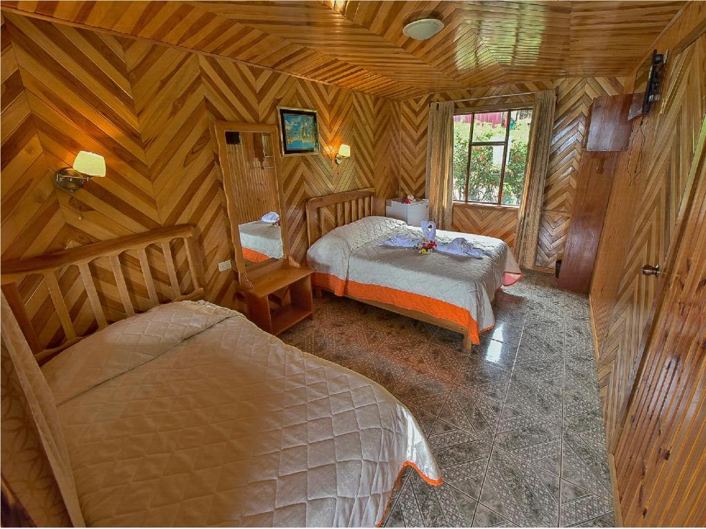 Postel nebo postele na pokoji v ubytování Hotel Don Taco