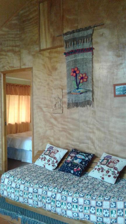 Postel nebo postele na pokoji v ubytování Cabañas Quito