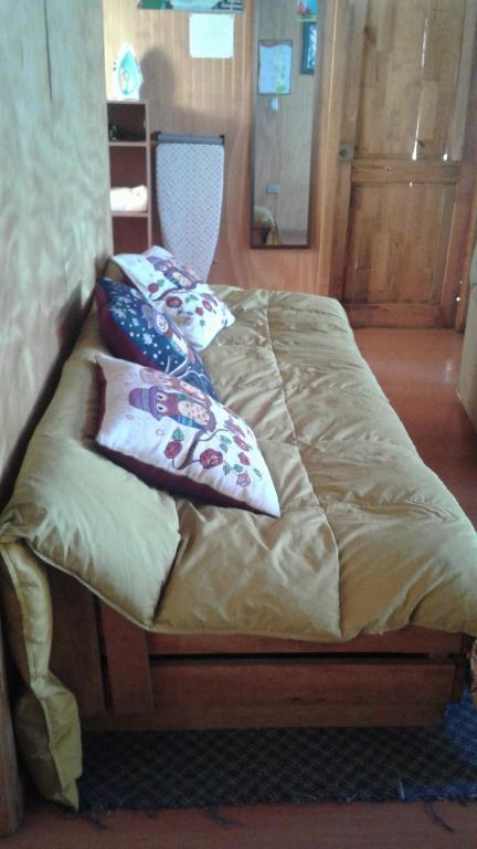 Postel nebo postele na pokoji v ubytování Cabañas Quito