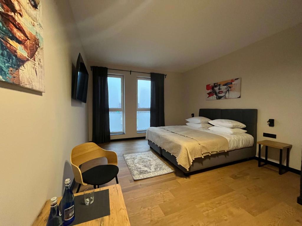 Ένα ή περισσότερα κρεβάτια σε δωμάτιο στο K2 Loft apartHotel