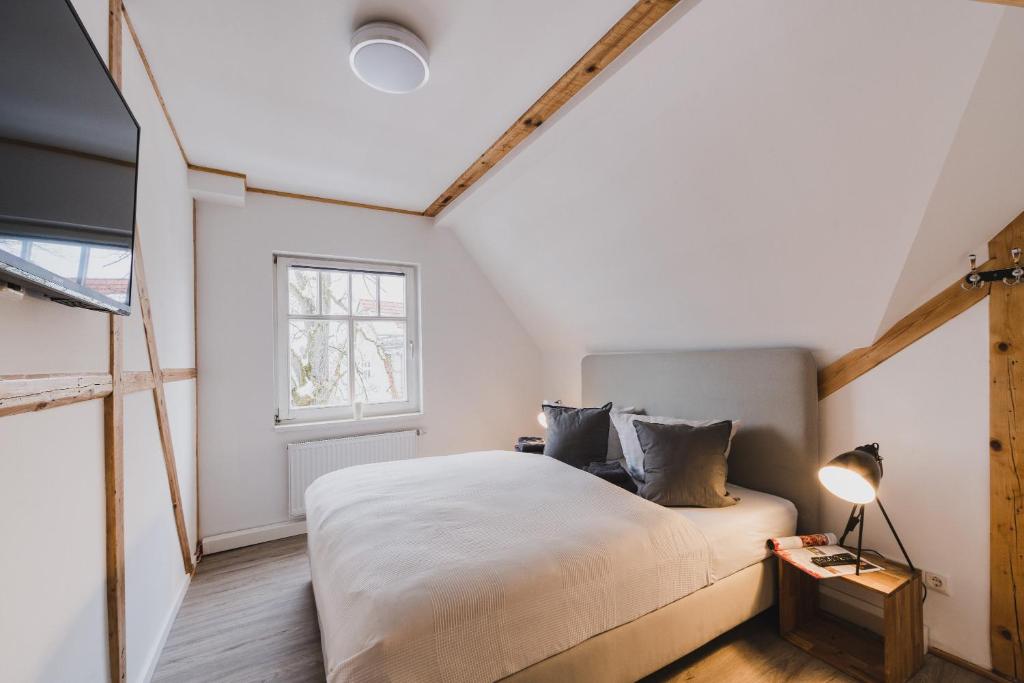 Ένα ή περισσότερα κρεβάτια σε δωμάτιο στο HarzLodge Emma