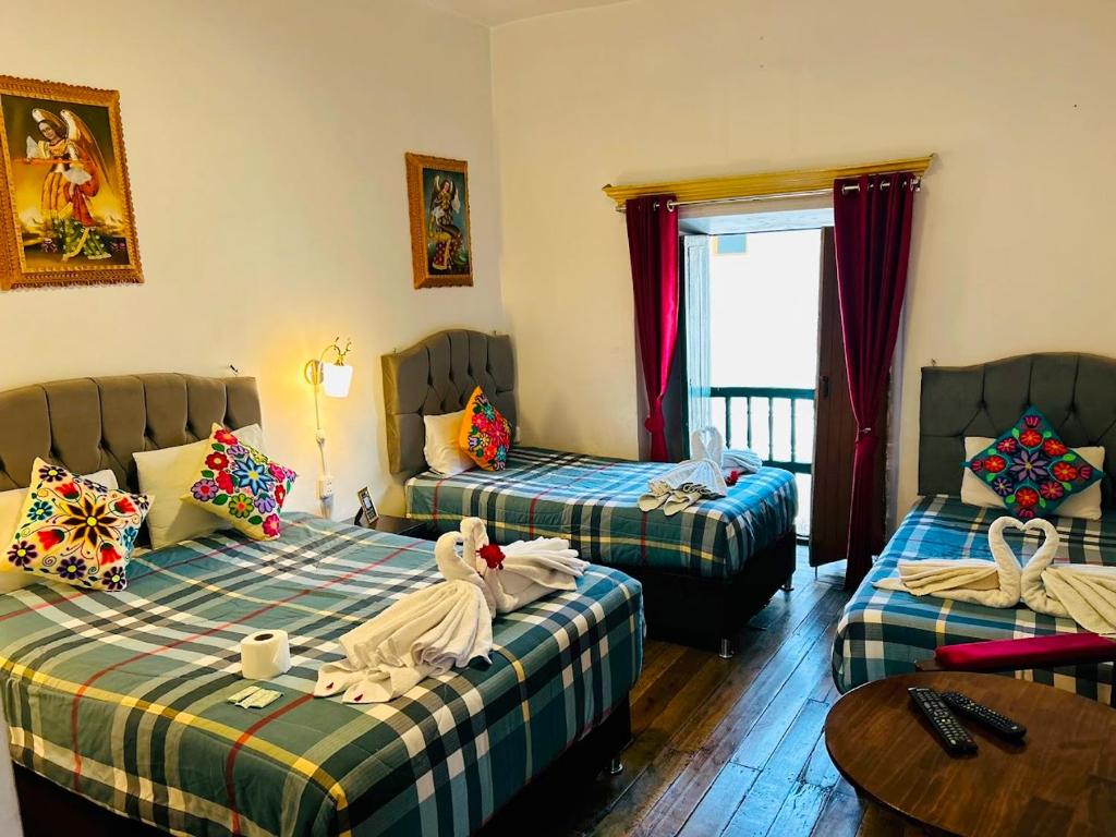 Postel nebo postele na pokoji v ubytování Hotel el Conquistador