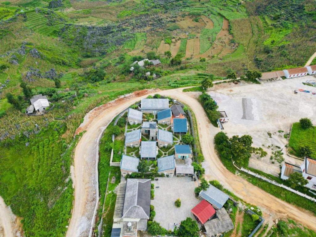 an aerial view of a house on a hill at Thào Gia Homestay Mèo Vạc in Ha Giang