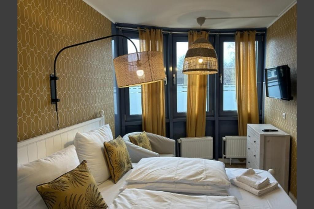 En eller flere senge i et værelse på BoLA Ferienwohnung Hamburg 50a mit Balkon Familienfreundlich für 4 Personen, Parkplatz