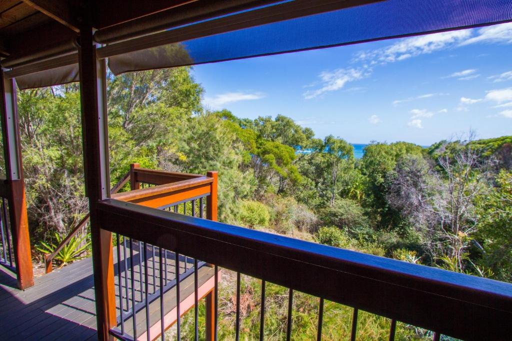 a balcony with a view of the ocean at Bimbimbi • Coastal Hideaway • 2BR 1770 Views in Seventeen Seventy