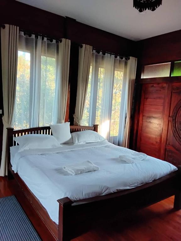 Ένα ή περισσότερα κρεβάτια σε δωμάτιο στο Huan Janto Homestay - Ubekkha