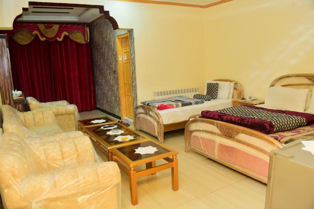 Postel nebo postele na pokoji v ubytování Hotel Ambassador