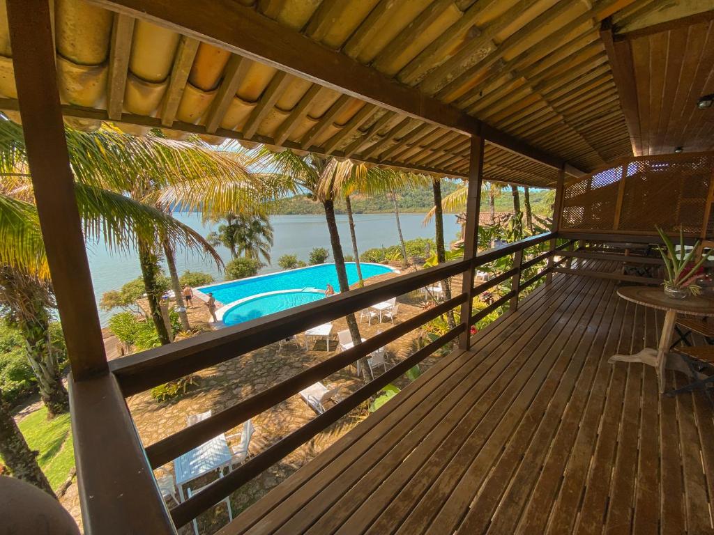 a view from the deck of a resort with a swimming pool at Santa Clara Hotel in Paraty