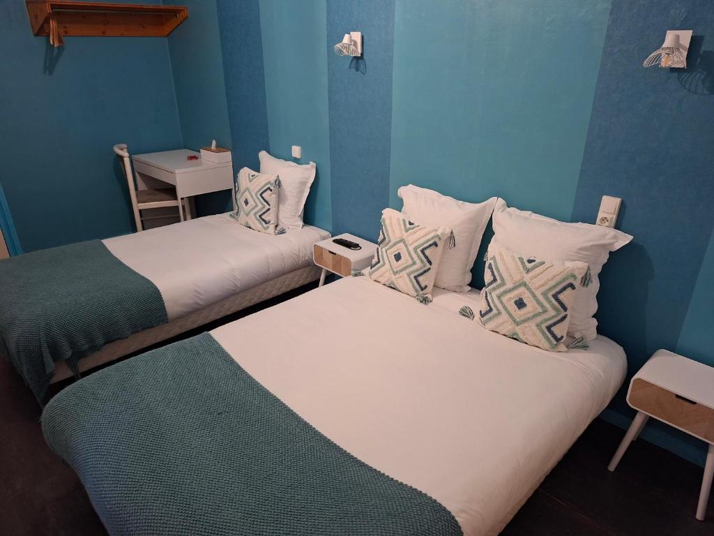 Postel nebo postele na pokoji v ubytování Hôtel JurJura