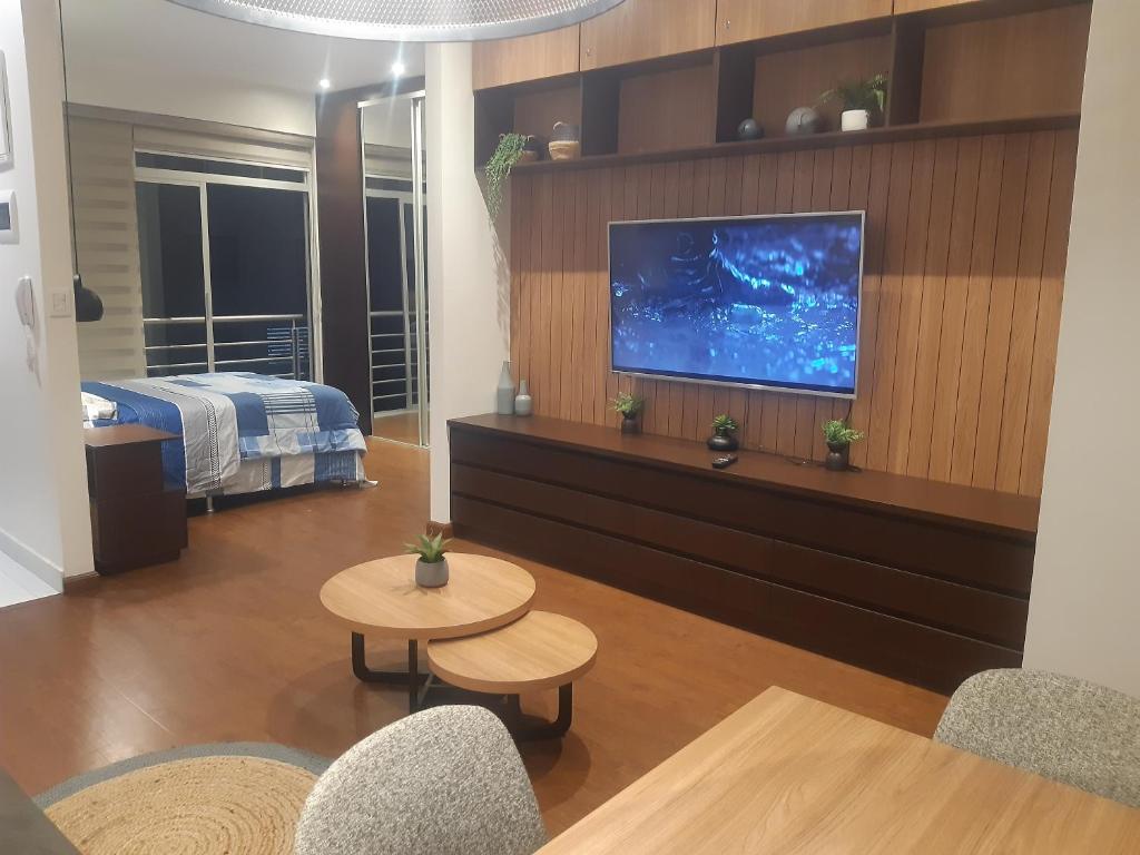 En eller flere senge i et værelse på Garzonier más Piscina