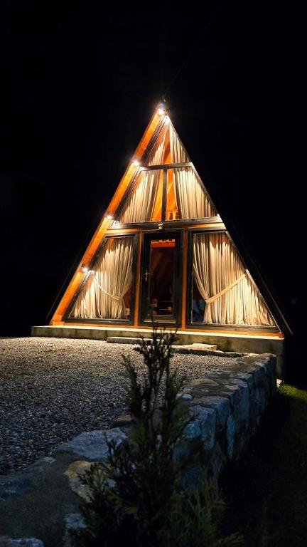 a large wooden house with a bunch of windows at Brvnara BOGDAN in Kolašin