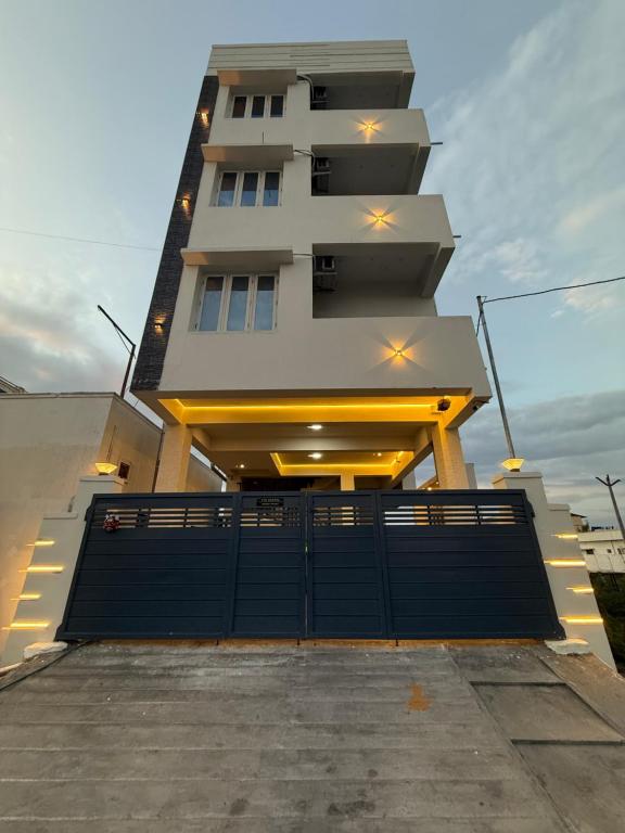 a large building with a gate in front of it at TVK Grands 7 - Premium Two Bedroom Apartment in Coimbatore