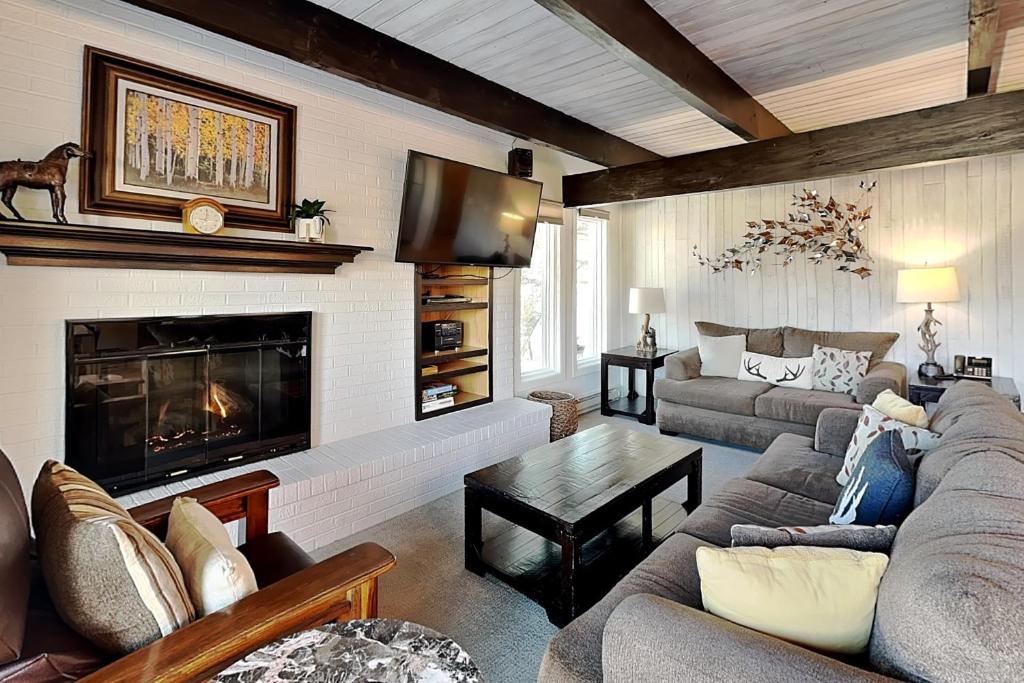 a living room with a couch and a fireplace at Timberline Condominiums 3 Bedroom Standard Unit D2A in Snowmass Village