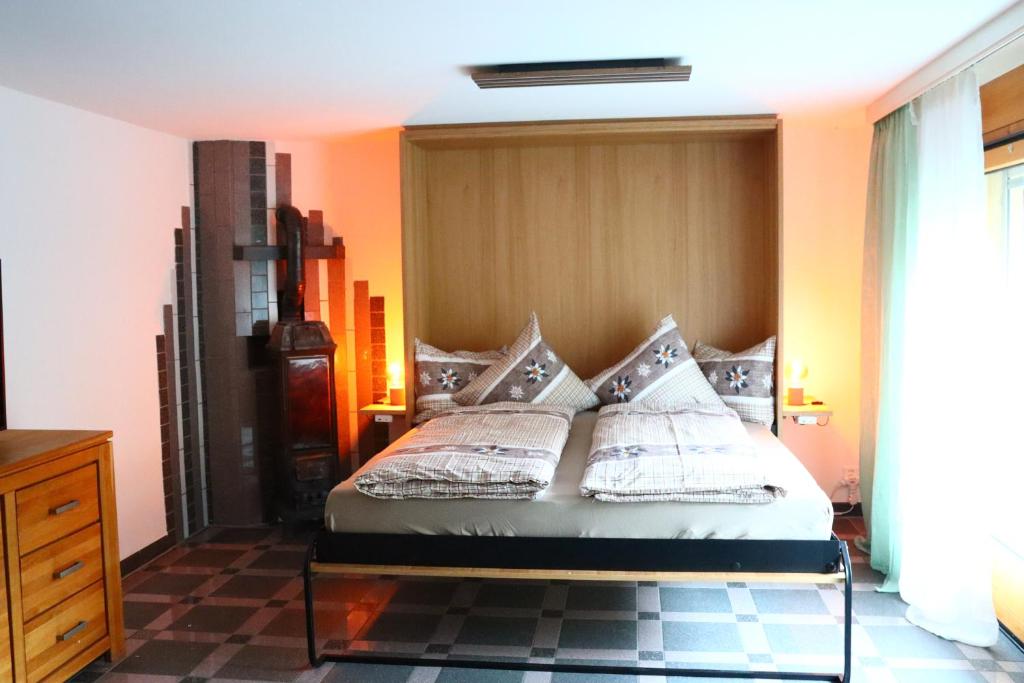 a bedroom with a bed with pillows on it at Ferienwohnung an der Seez in Mels