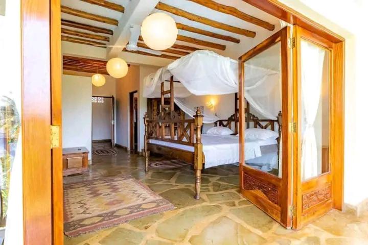 Una cama o camas en una habitación de Villa La Diani