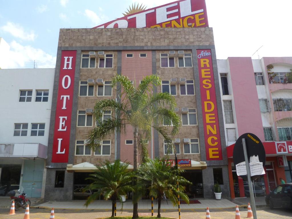 a building with a sign that reads hotel exchange at Atlas Hotel Residence in Taguatinga