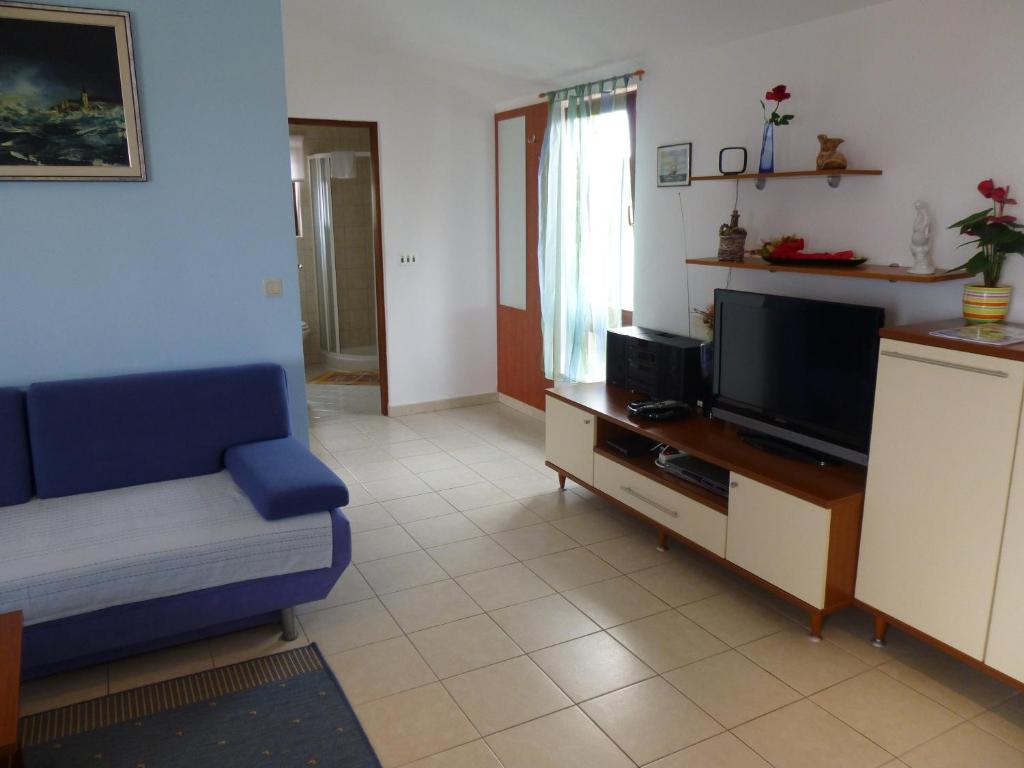 Telewizja i/lub zestaw kina domowego w obiekcie Apartment Grozic