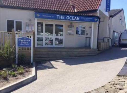 a store with a sign in front of a building at Gemini in Heysham