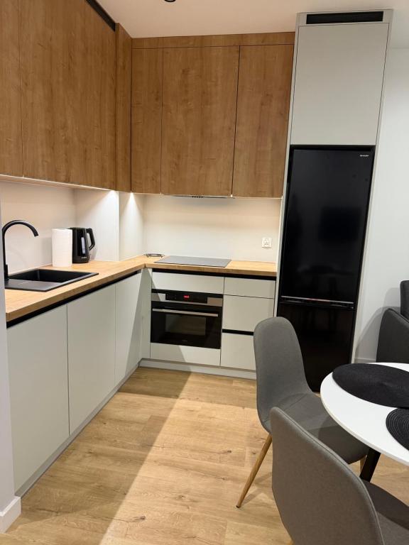 Kuchyň nebo kuchyňský kout v ubytování MG Rentals Ks Popiełuszki