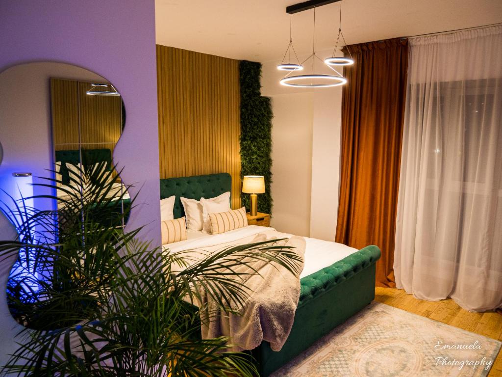 En eller flere senge i et værelse på Penthouse Aeroport Iasi