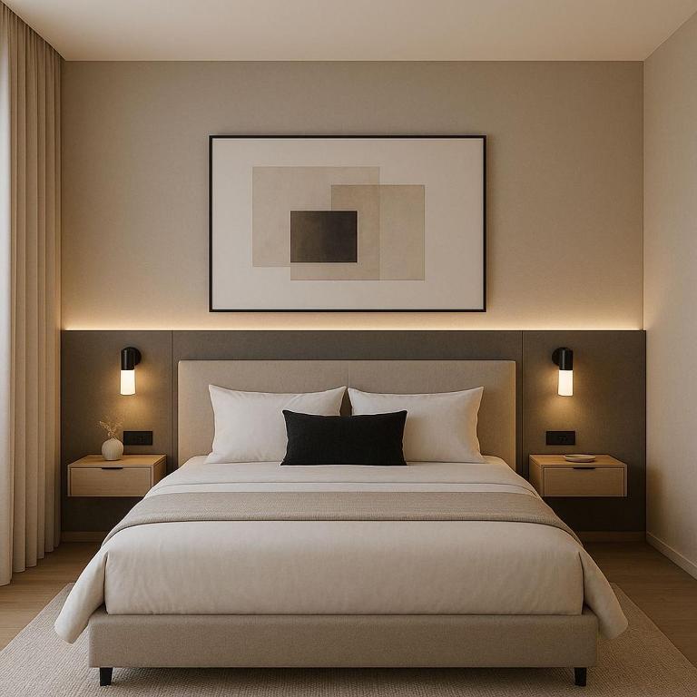 ein Schlafzimmer mit einem großen weißen Bett mit zwei Nachttischen in der Unterkunft Ace Lagoon View Airport Hotel in Katunayaka