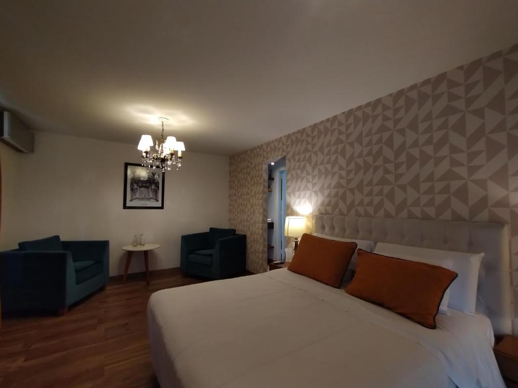 Postel nebo postele na pokoji v ubytování Maitre Hotel Boutique