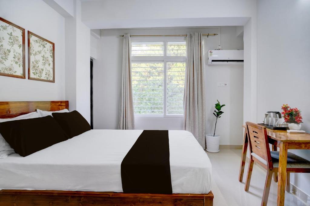 Una cama o camas en una habitación de Hotel O La Vita Oasis