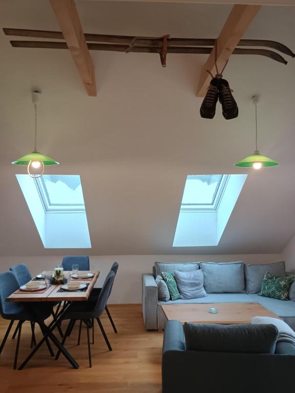 a living room with a couch and a table at Apartmán Vail in Svoboda nad Úpou
