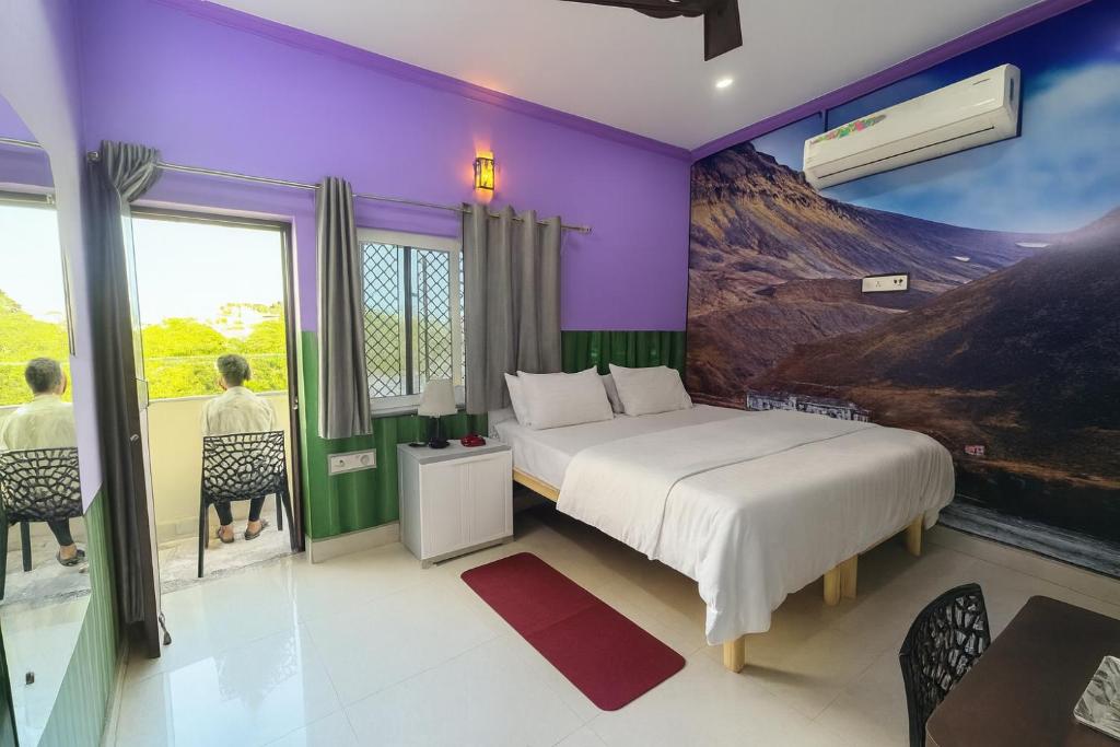 Postel nebo postele na pokoji v ubytování Anukampa Paying Guest House