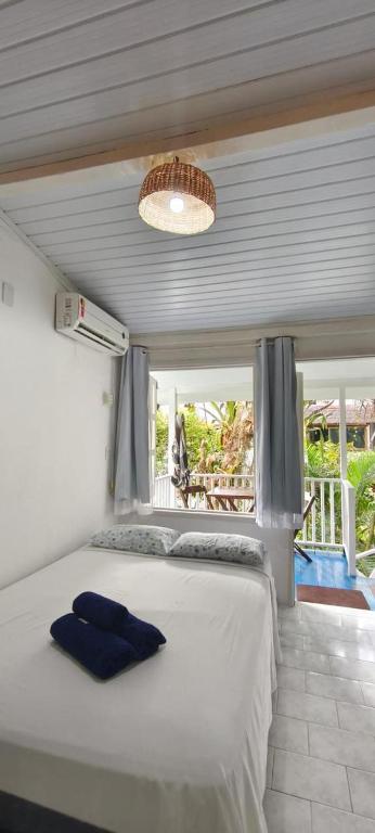 En eller flere senge i et værelse på Morada da Biquinha