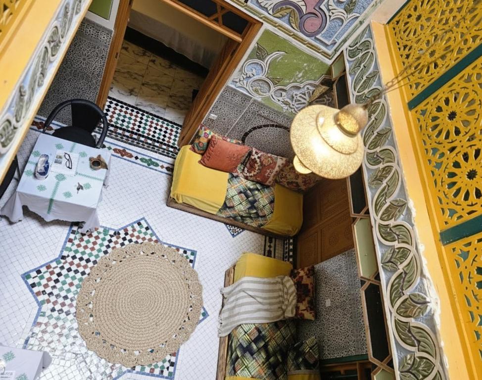 an overhead view of a room with a table and a hat at Riad Dalia - Fes Medina in Fez