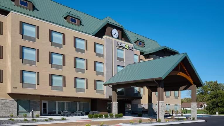 a hotel with a clock on top of a building at Home 2 Suites by Hilton Frankenmuth in Frankenmuth