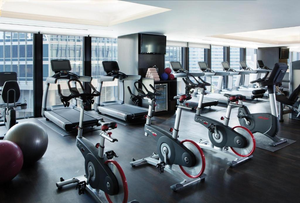 a gym with several treadmills and exercise bikes at The Langham Chicago in Chicago