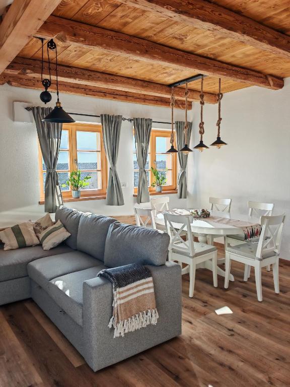 a living room with a couch and a table at Hiša Šturm in Tolmin