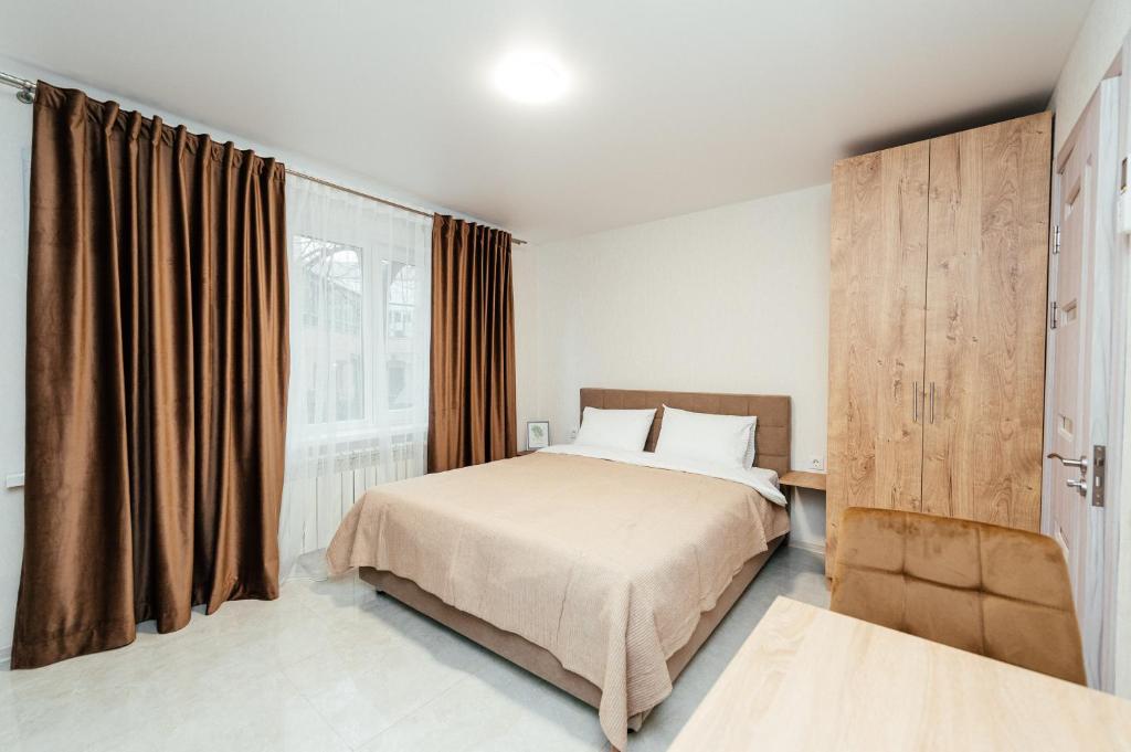 Ένα ή περισσότερα κρεβάτια σε δωμάτιο στο Aparthotel Bulevardul Moscova