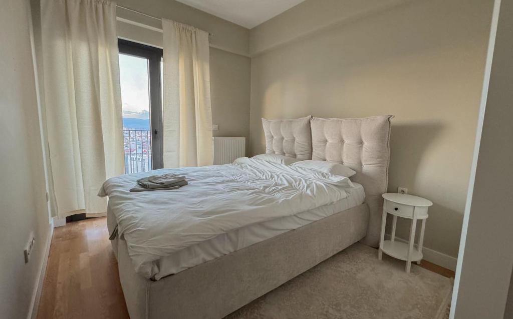 En eller flere senge i et værelse på Marble Horizon Skyline