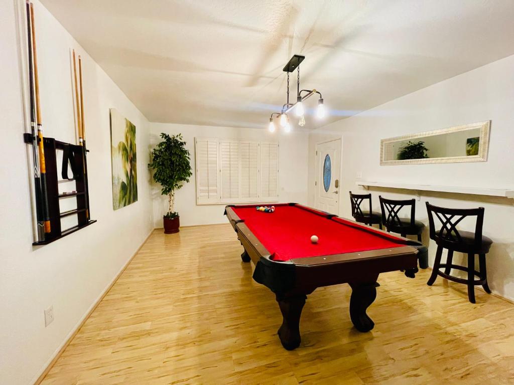 a living room with a pool table in it at Tempe Escape with Heated Pool, Billiards & Firepit Fun in Tempe